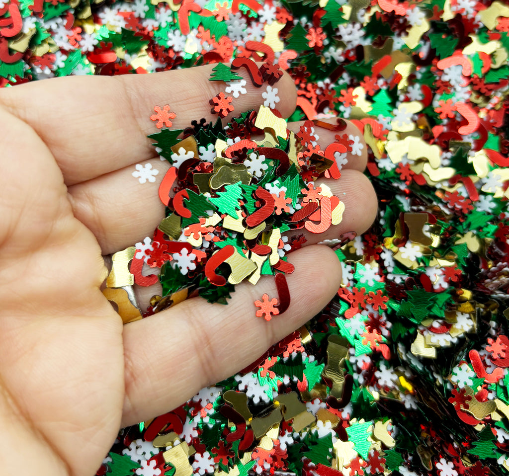 a hand holding a pile of colorful confetti