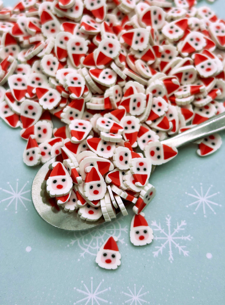 a pile of red and white buttons sitting on top of a table