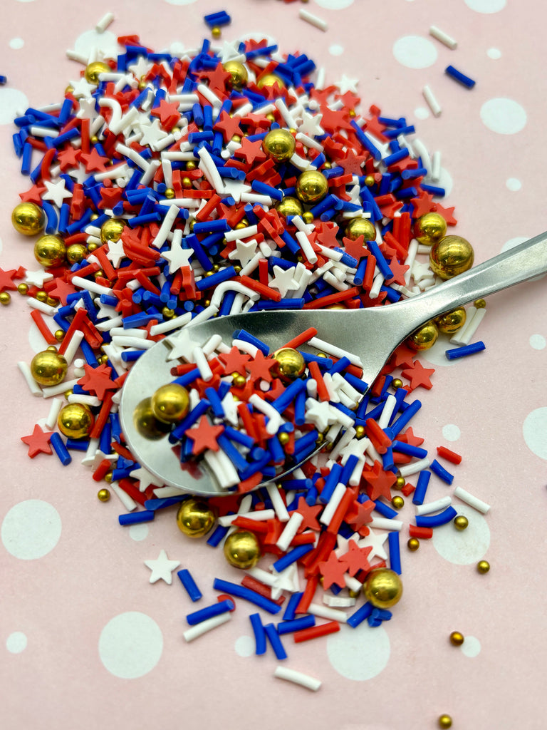 a pile of red, white and blue sprinkles and a pair of