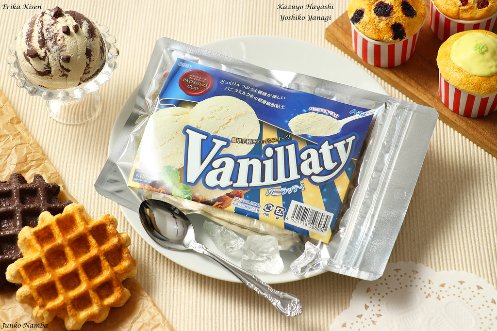 a bag of vanilla ice cream next to waffles and cupcakes