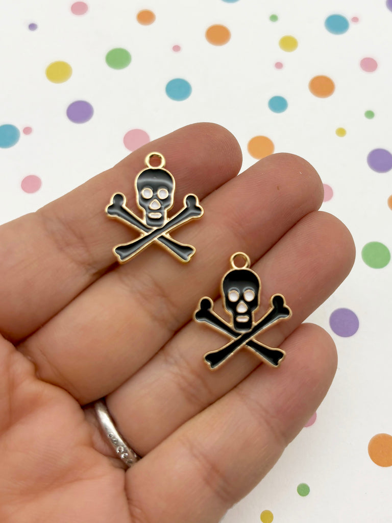 a pair of skull and crossbones earrings