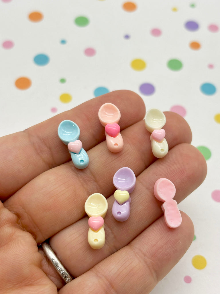 a person is holding a small group of small buttons