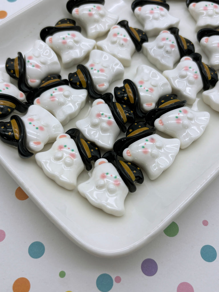 a white plate topped with lots of black and white skulls