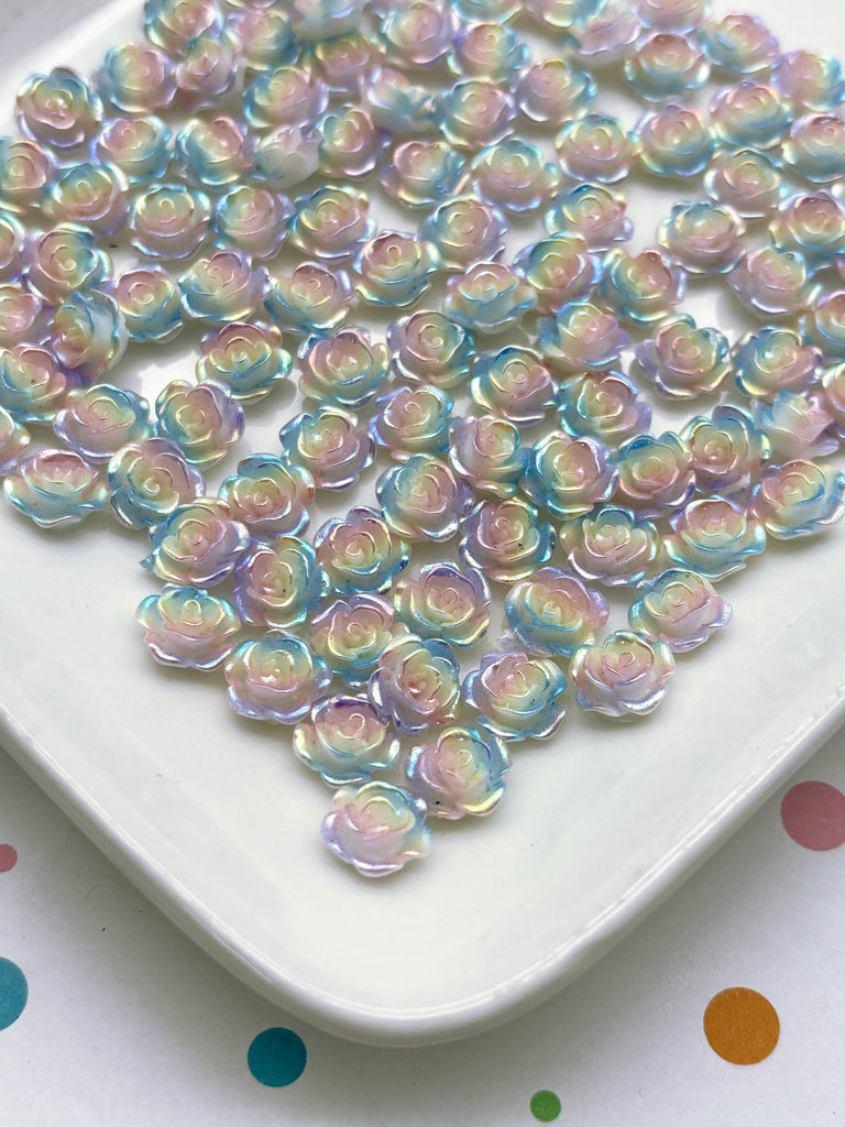 a white plate topped with lots of colorful beads