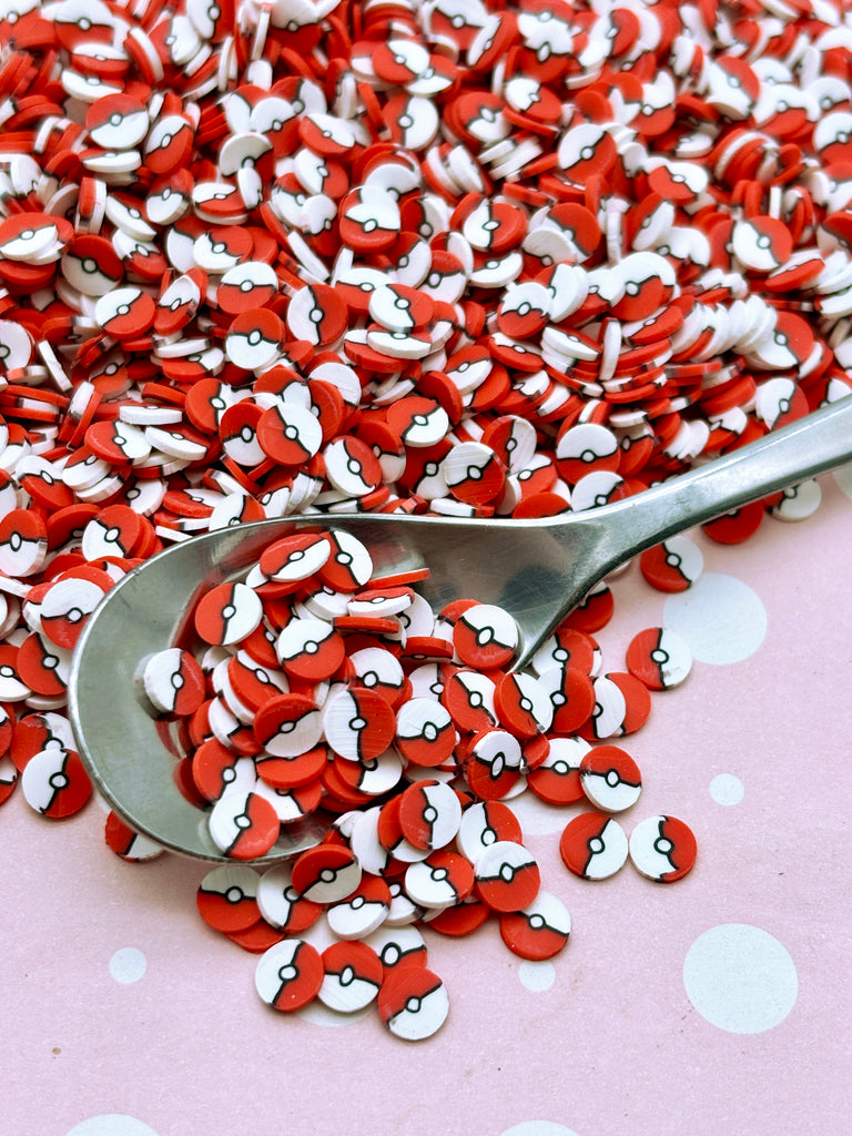 a spoon full of red and white hearts