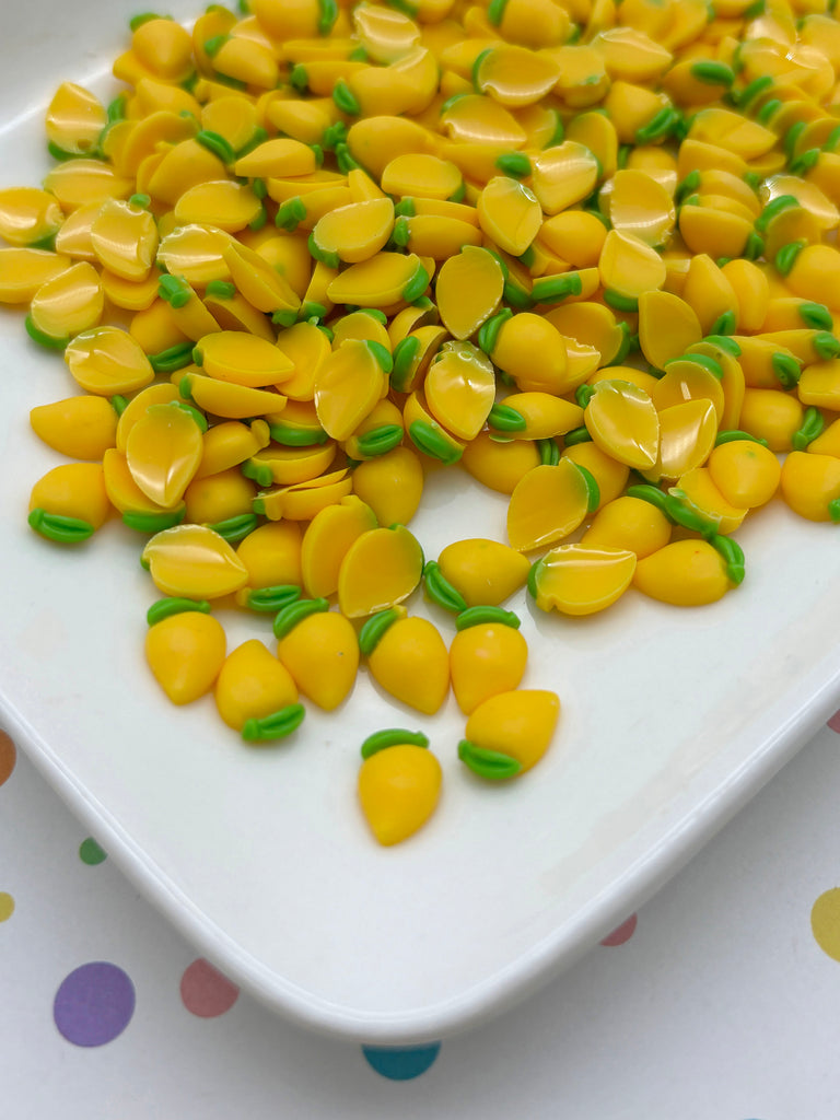 a white plate topped with yellow and green candy