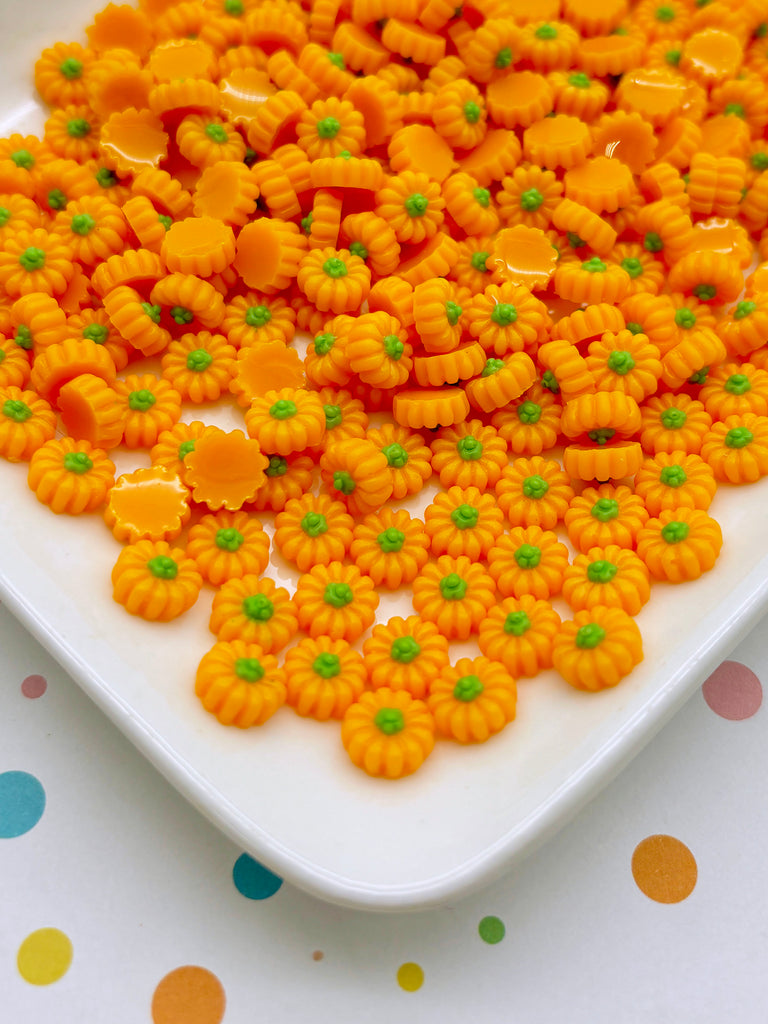 a white plate topped with yellow and green candies