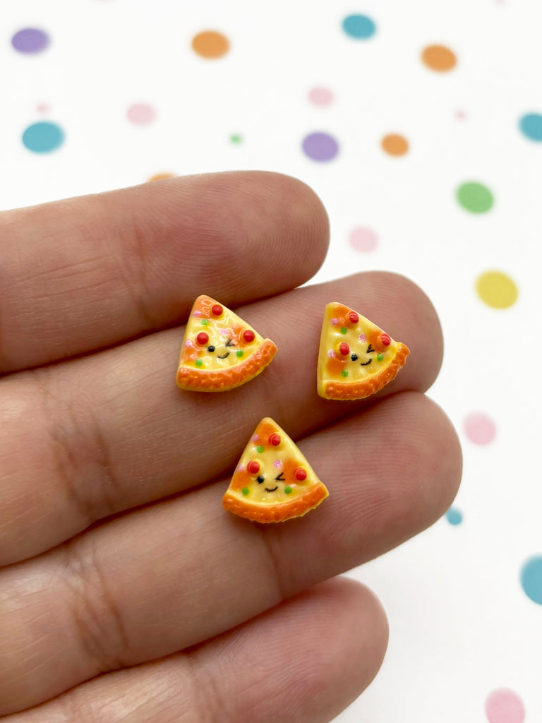 a person holding three tiny pizza slices in their hand