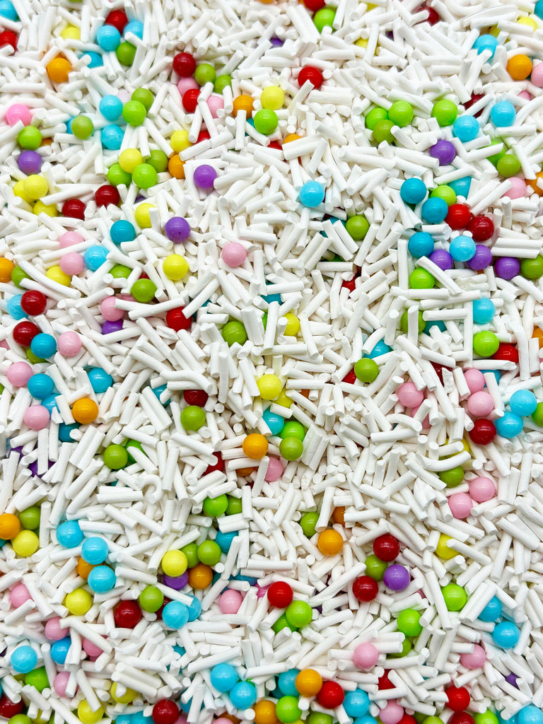 a pile of sprinkles and candy on a table