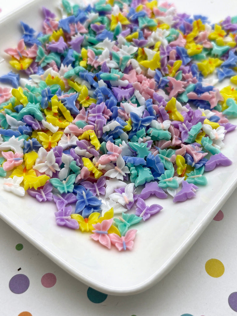 a white plate topped with lots of colorful sprinkles