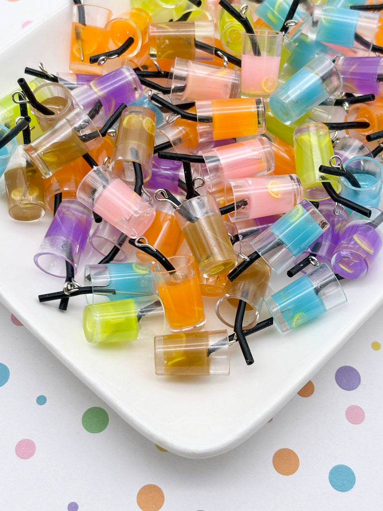 a white plate filled with a variety of colorful plastic cups and straws, creating a playful and vibrant display.