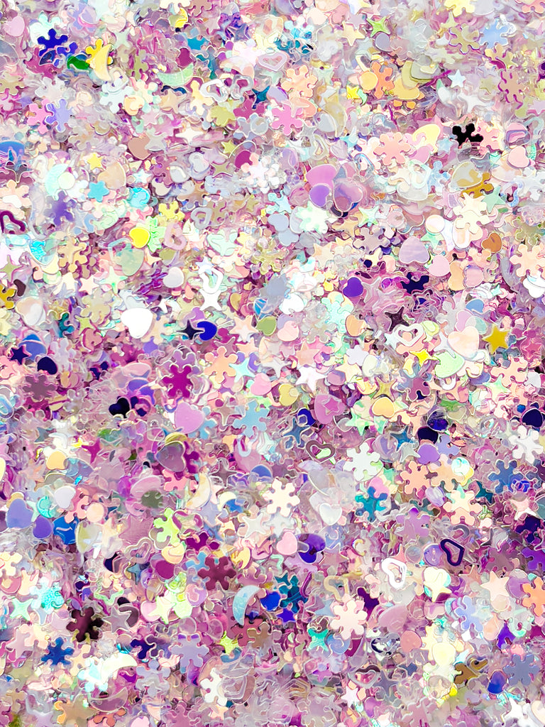 The image is a collage of various colorful shapes and patterns, including flowers, hearts, and snowflakes, creating a vibrant and visually appealing composition.