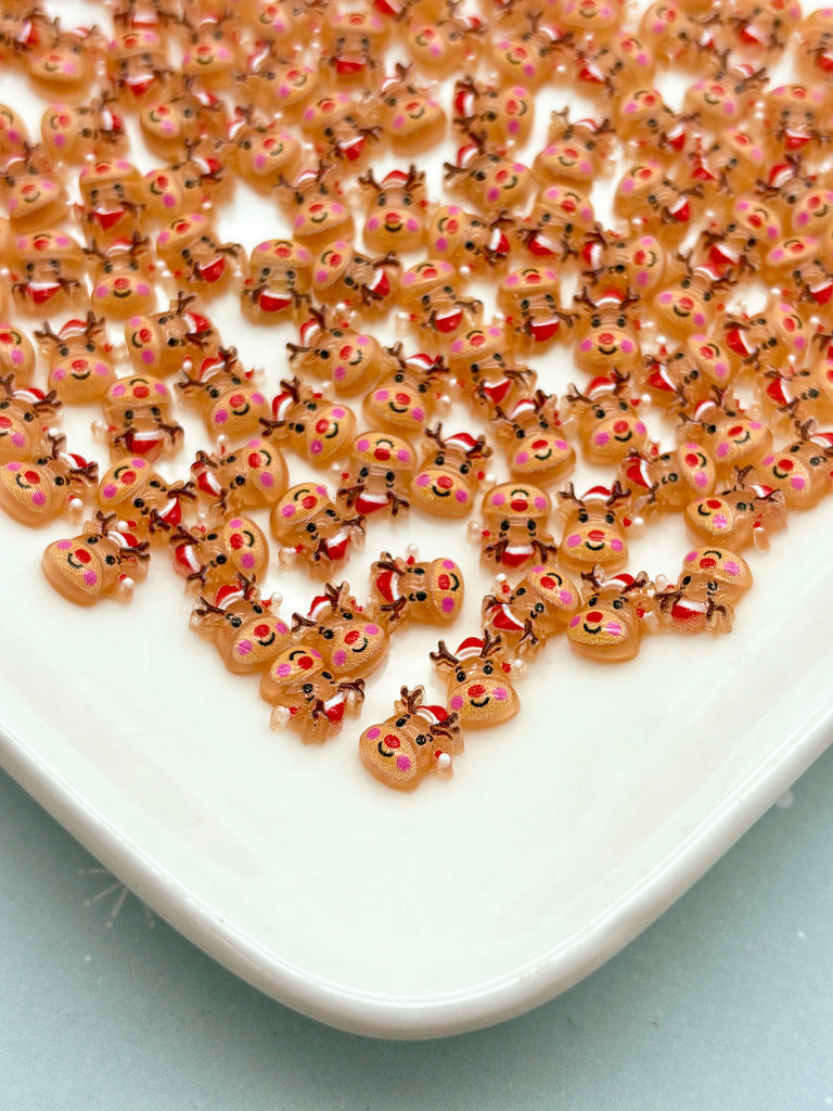 a white plate topped with lots of brown and pink sprinkles