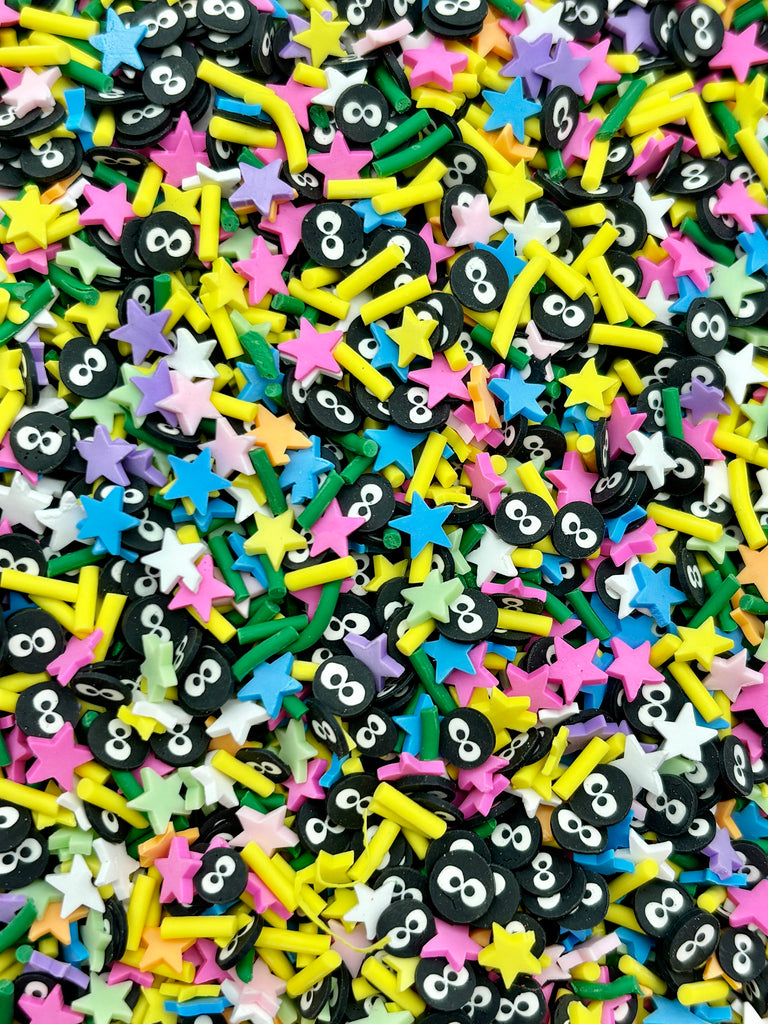 a pile of black and yellow stars and skulls