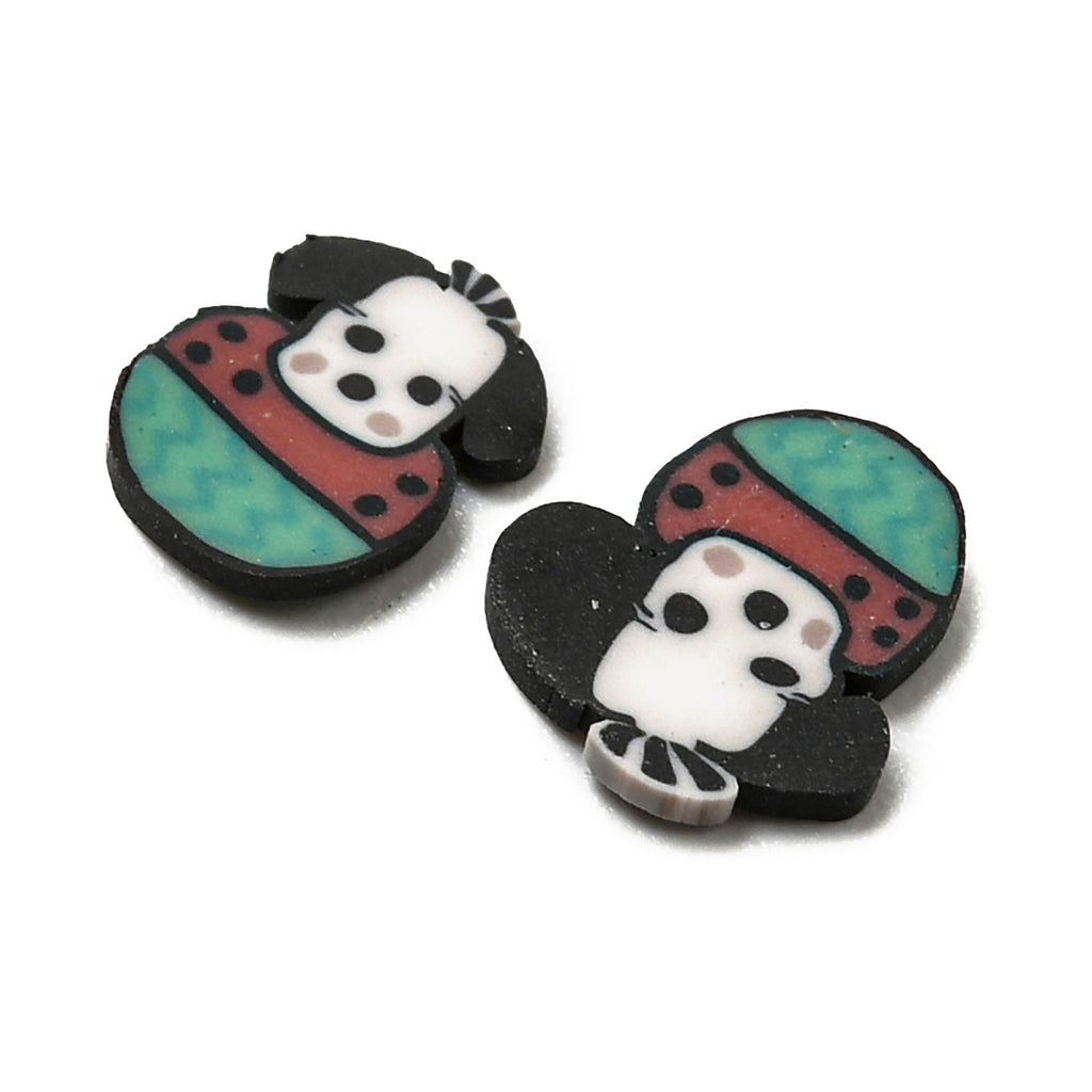 two black and white buttons with a panda bear on them