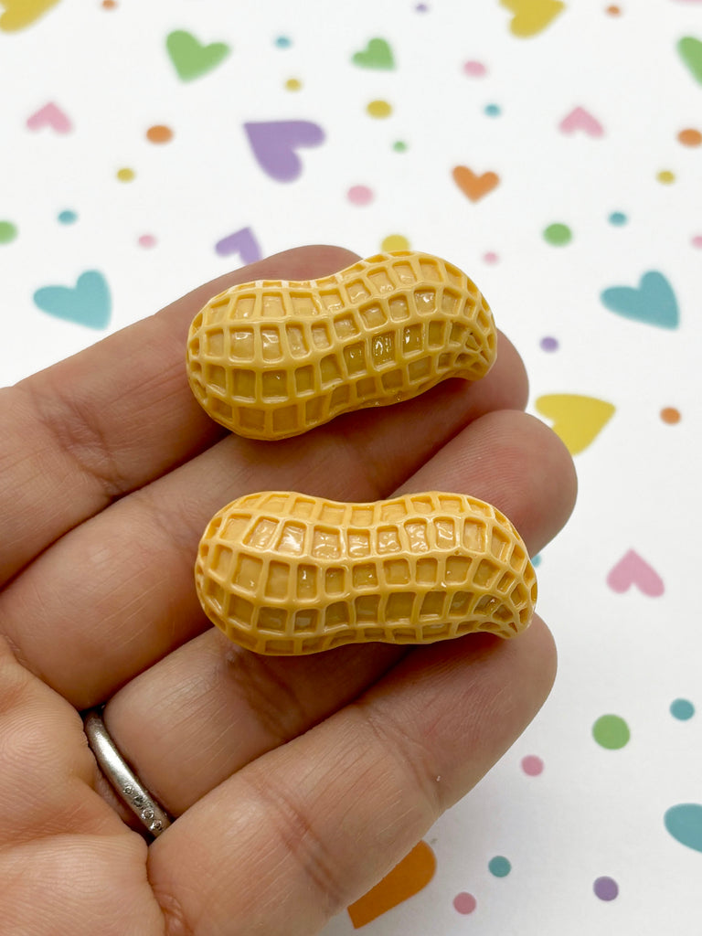 a person is holding two small yellow waffles