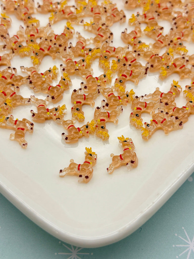 a white plate topped with lots of brown teddy bears