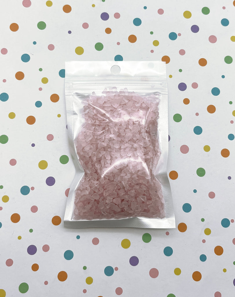 a bag of pink rice sitting on top of a table