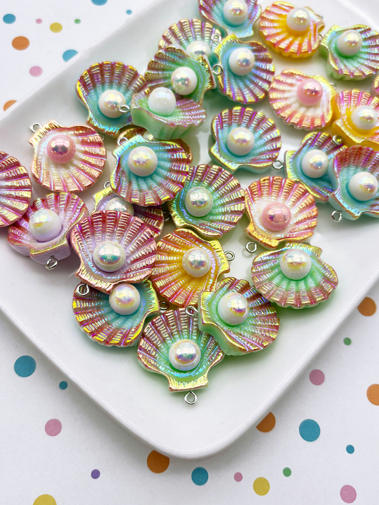 a collection of colorful, iridescent pearl-like objects arranged on a white plate, with a polka dot background.