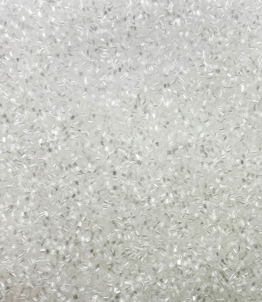 a close up of a white surface with small dots