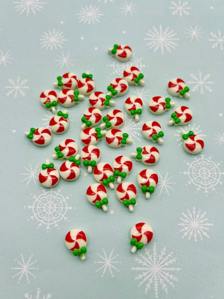 a pile of candy canes sitting on top of a table