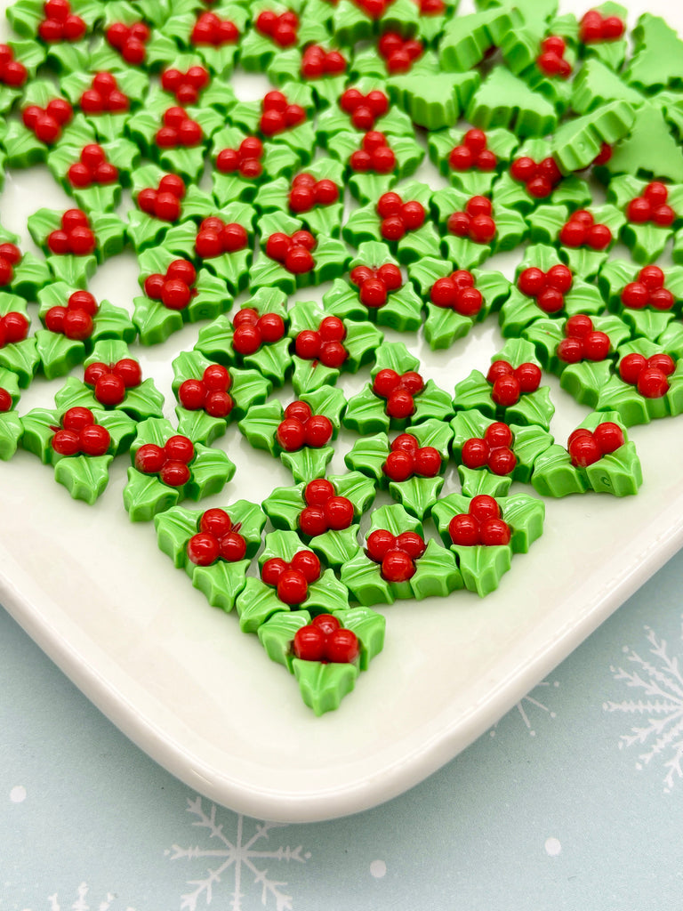 a white plate topped with green and red candies