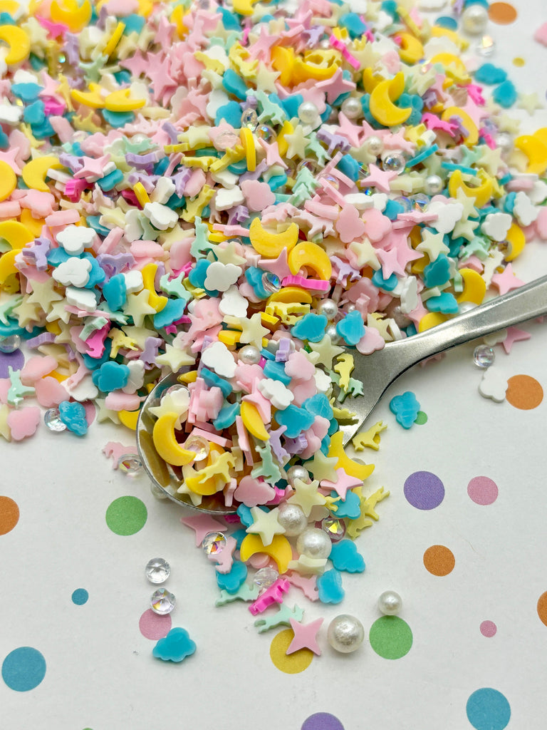 a spoon full of sprinkles on a table