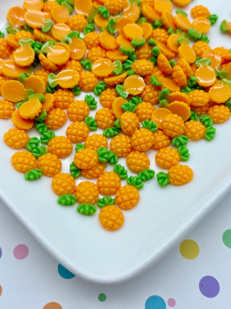 a white plate topped with lots of yellow and green candies