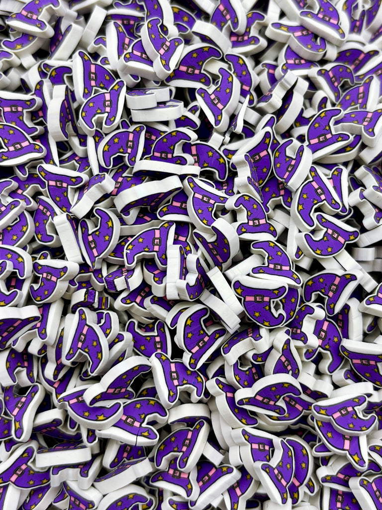 The image is a close-up of numerous purple and white objects, resembling small, colorful shapes or icons, arranged in a visually appealing manner.