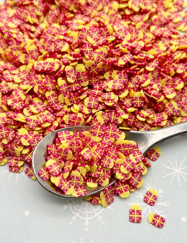 a spoon full of yellow and red candy flakes