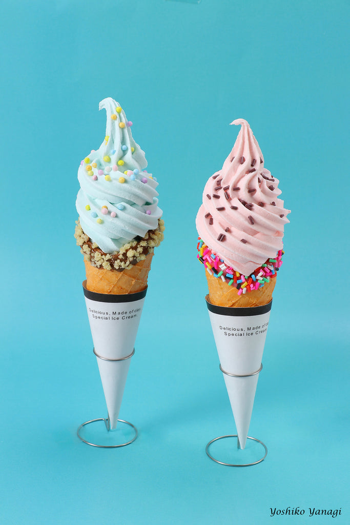 a couple of ice cream cones sitting on top of each other