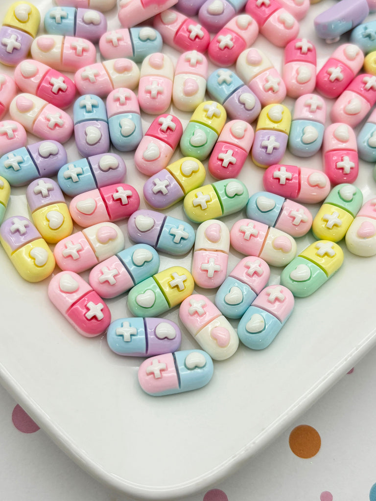 a white plate topped with lots of colorful beads