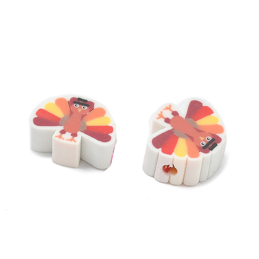 two white eraser shapes with turkey designs on them.
