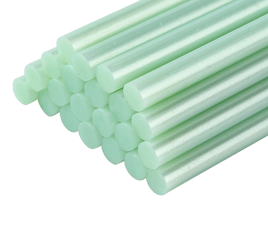 a group of green candles sitting on top of each other