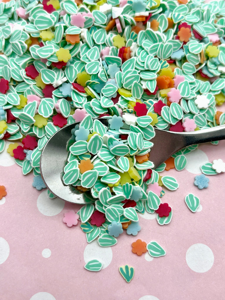 a spoon full of green and red sprinkles