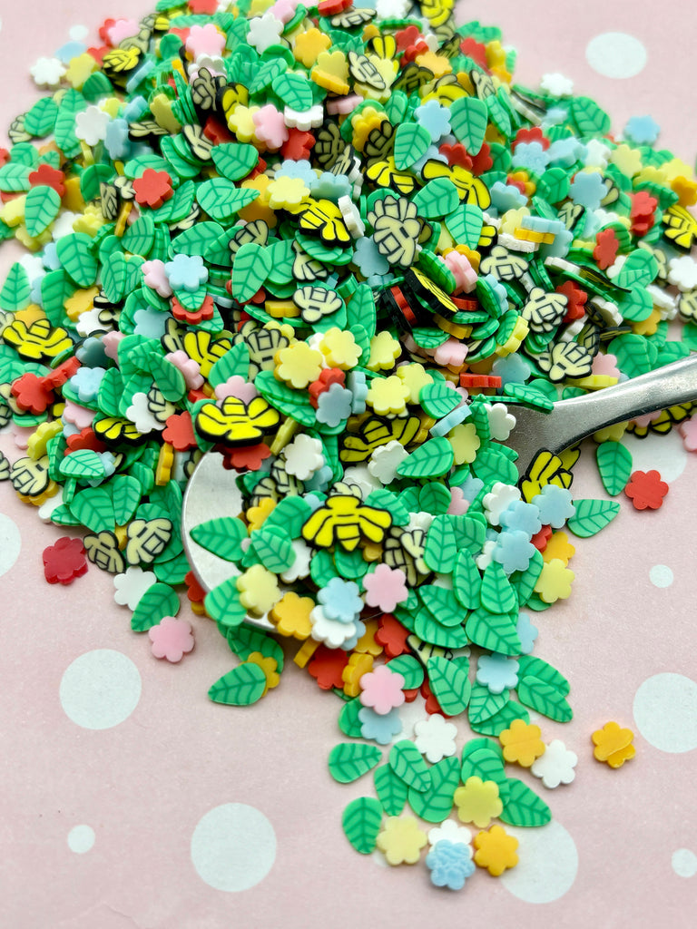 a spoon filled with lots of green and yellow sprinkles