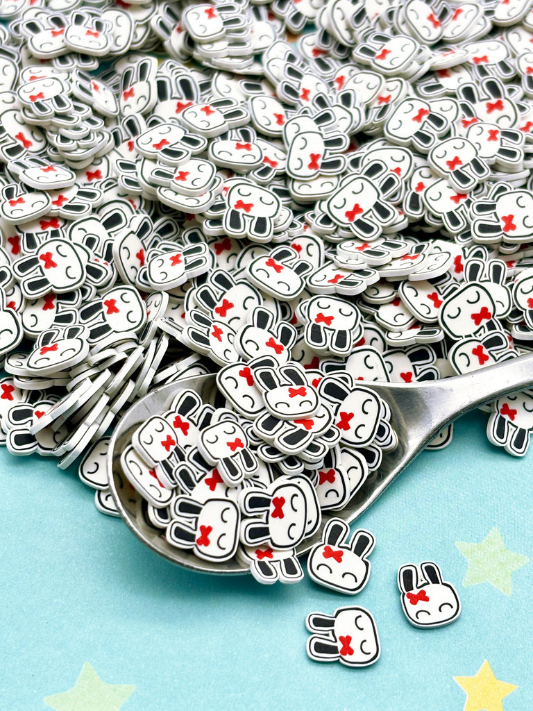 a pile of silver spoons sitting on top of a table