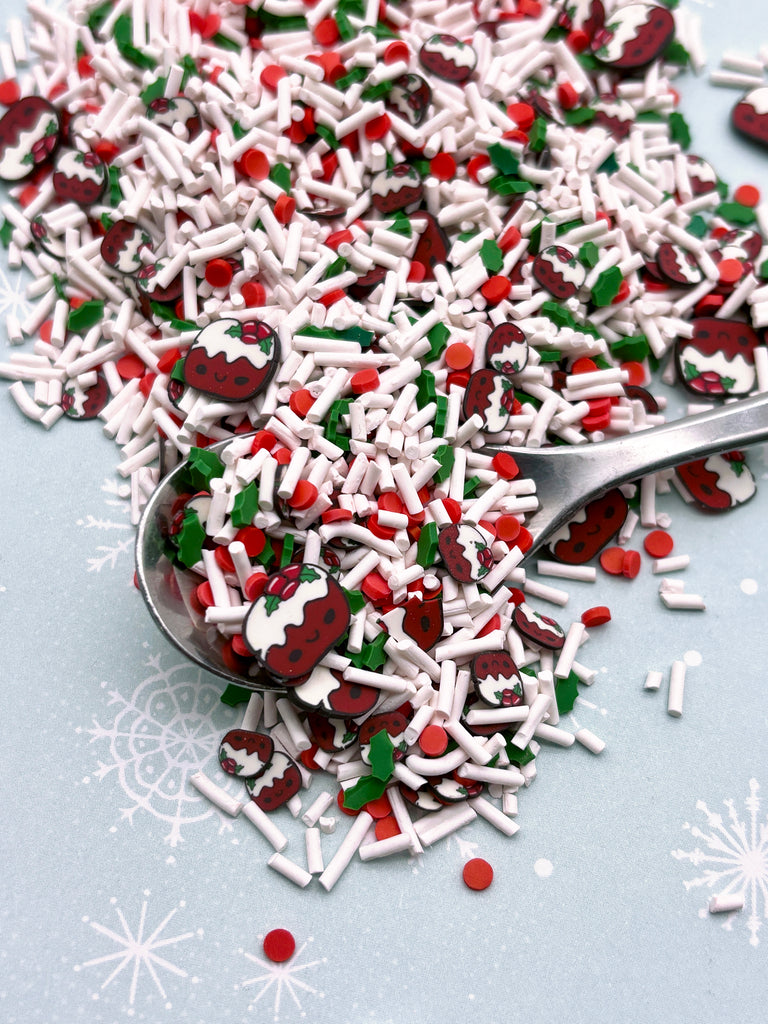 a spoon full of red and white sprinkles