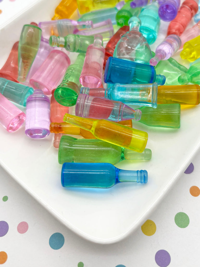 a white plate topped with lots of colorful plastic bottles