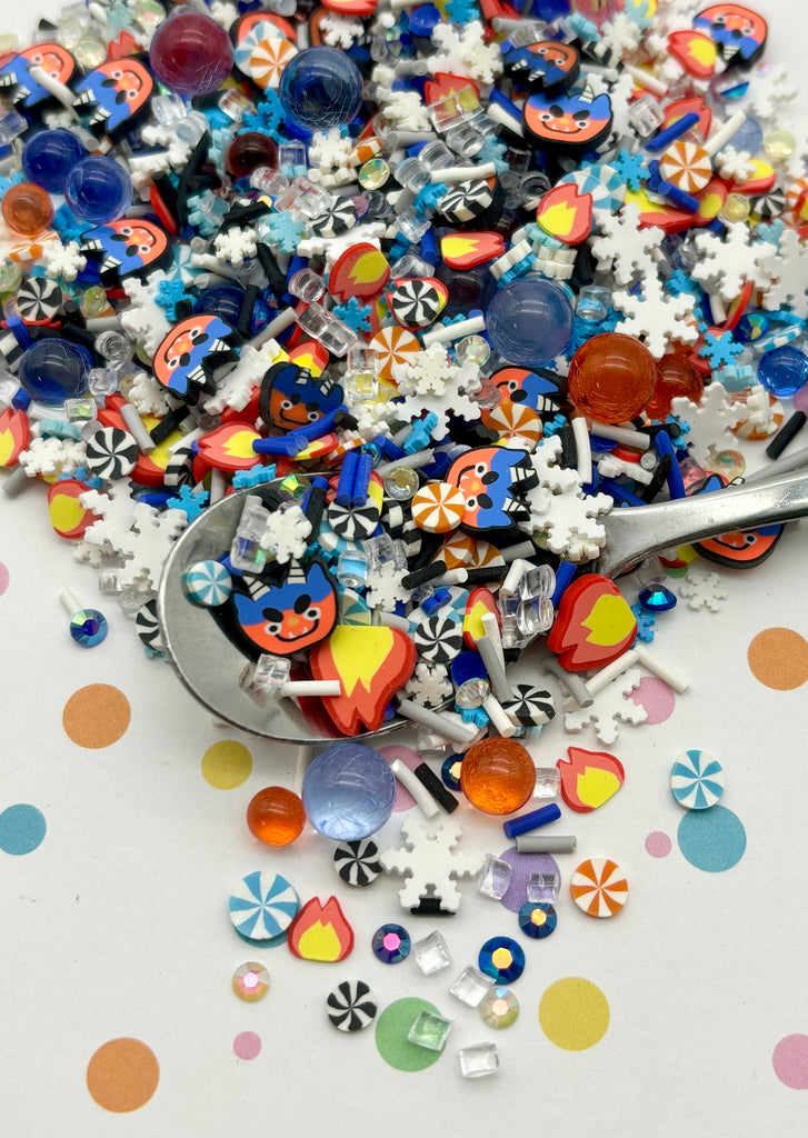 a spoon full of colorful buttons on top of a table