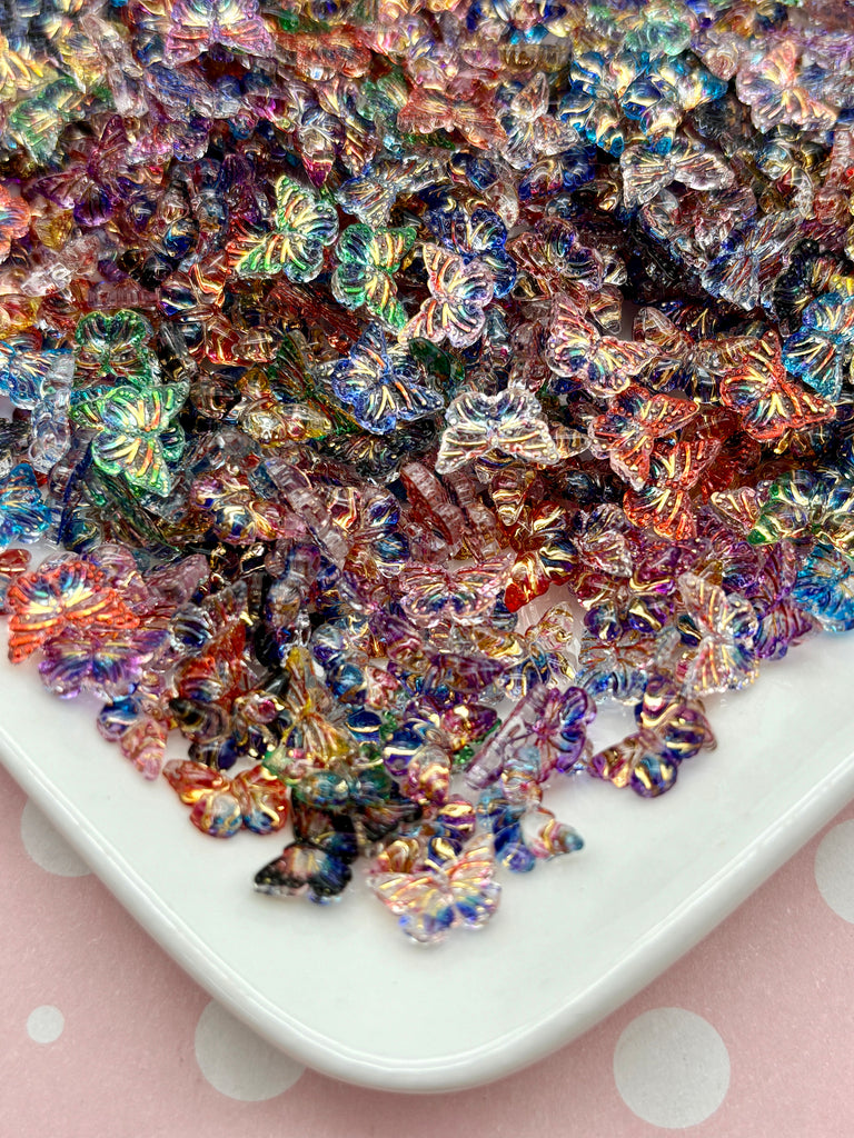 a white plate topped with lots of colorful beads