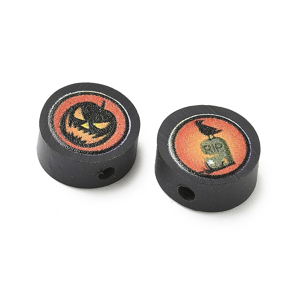 two black circular objects with Halloween-themed designs on them.