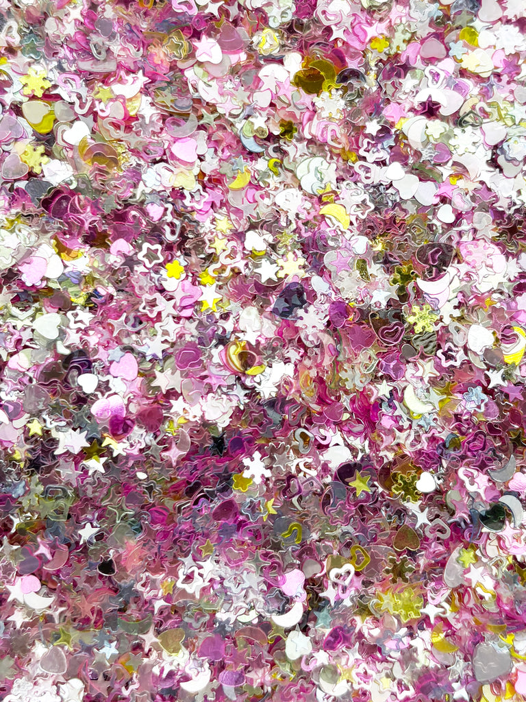 The image is a collage of various colorful and textured shapes, including stars, hearts, and other decorative elements, creating a visually striking and vibrant composition.