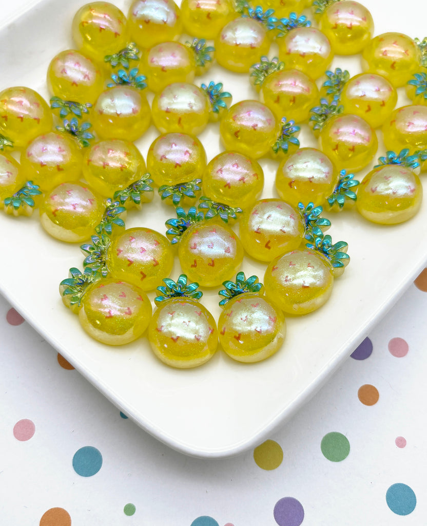 a white plate topped with lots of yellow beads