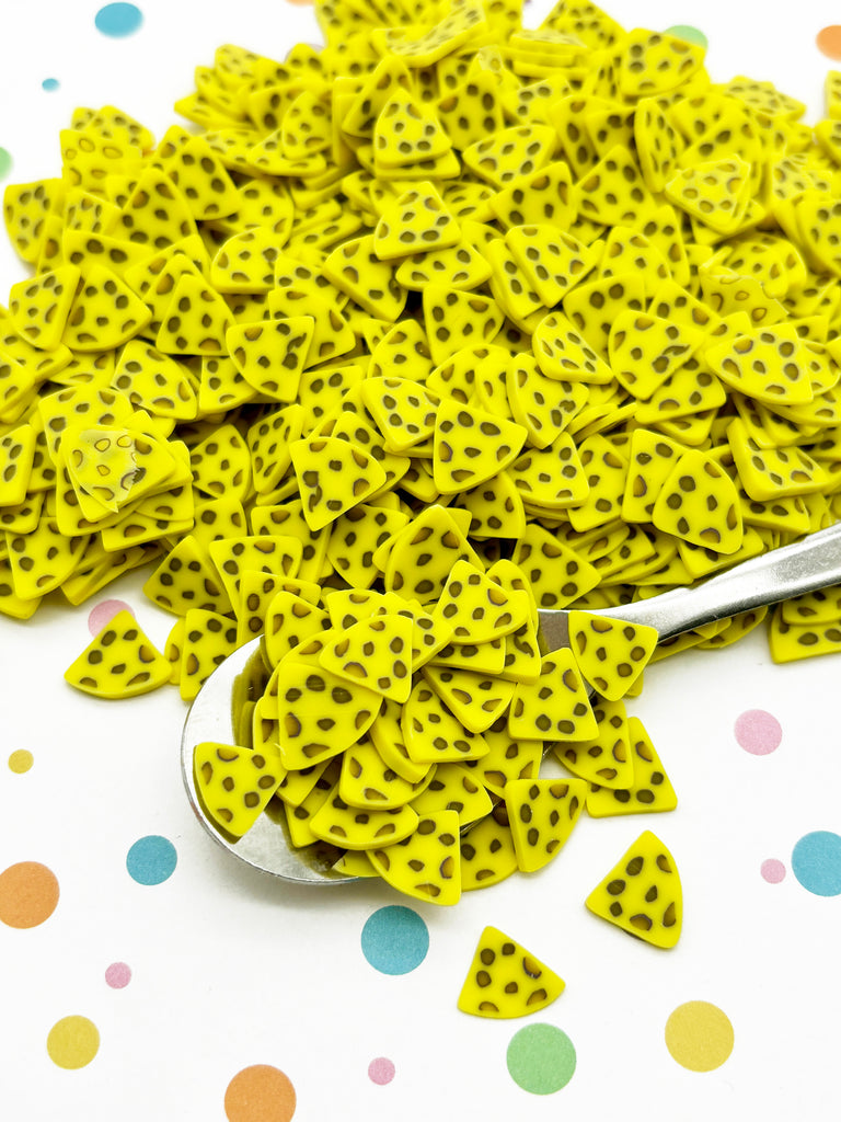 a spoon full of yellow and black polka dots