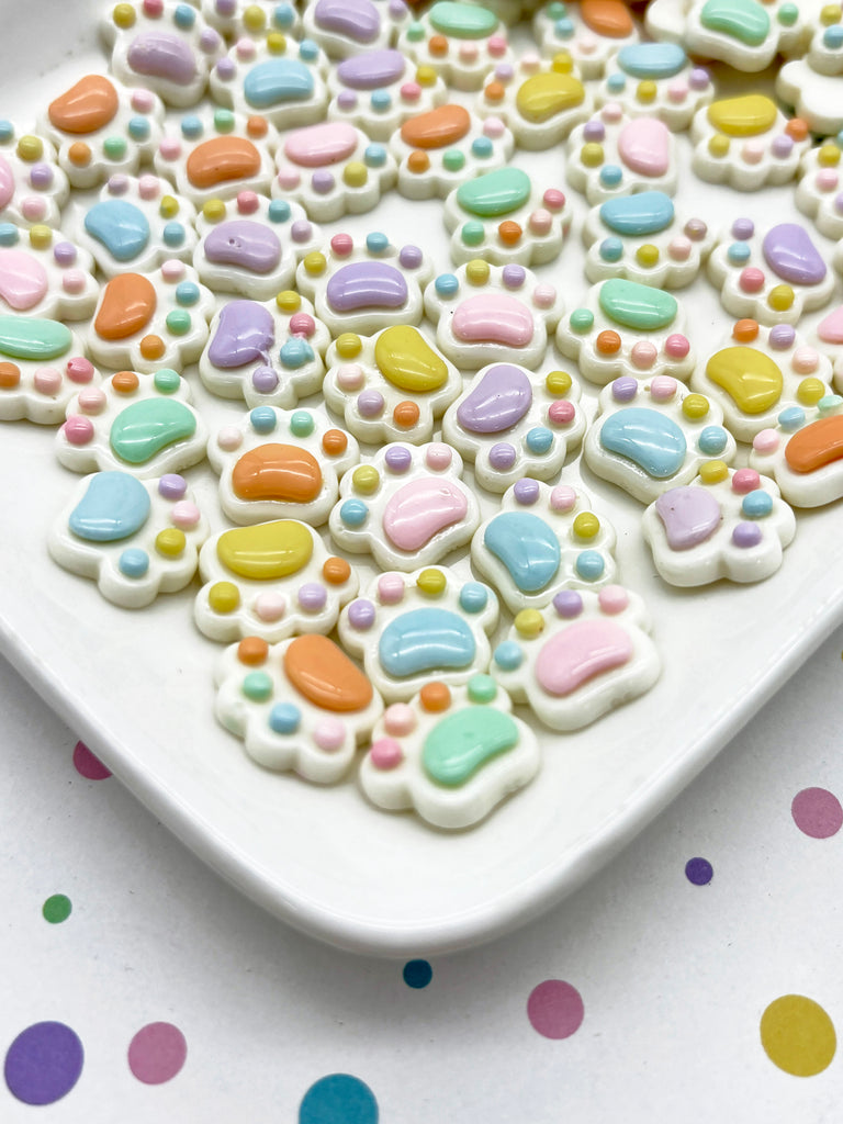 a plate of decorated cookies on a table