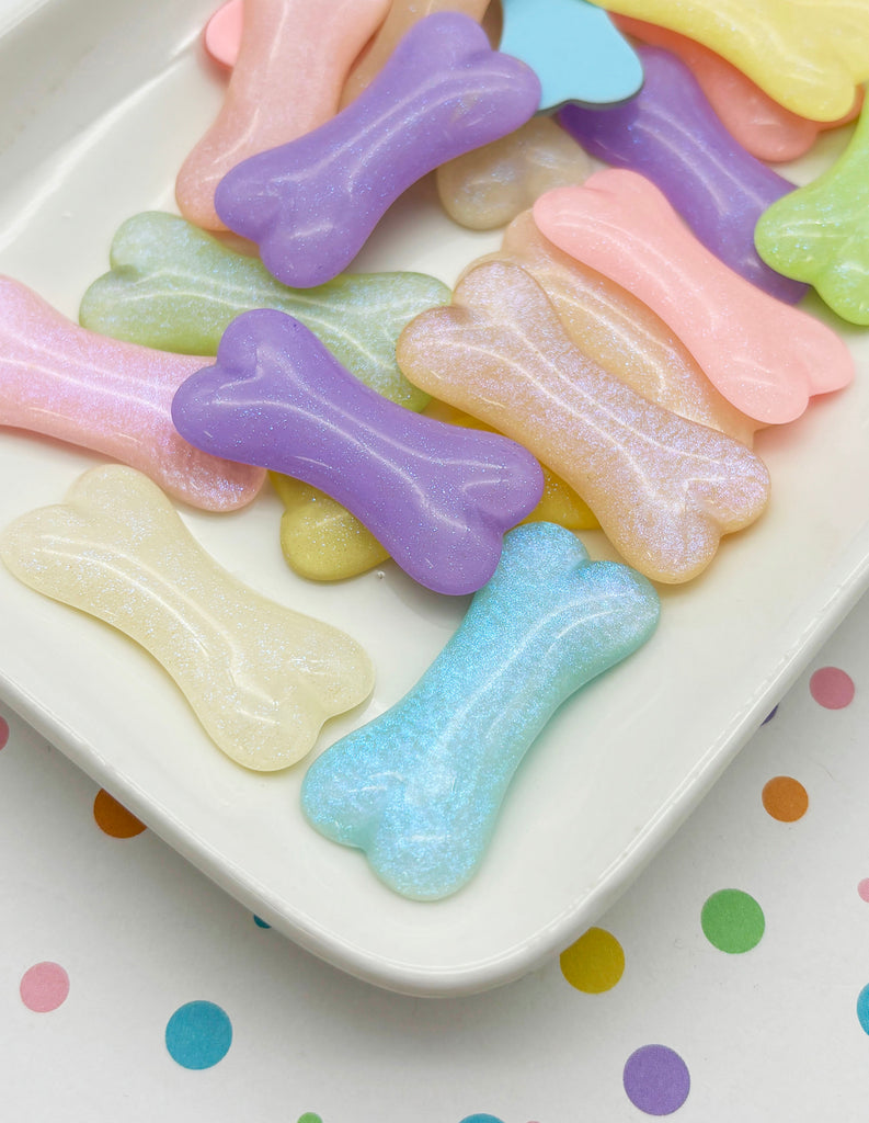 a white plate topped with lots of colorful dog bones