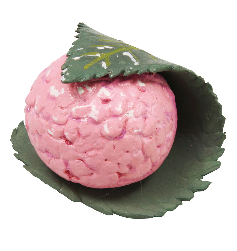 a pink ball with a green leaf on top of it