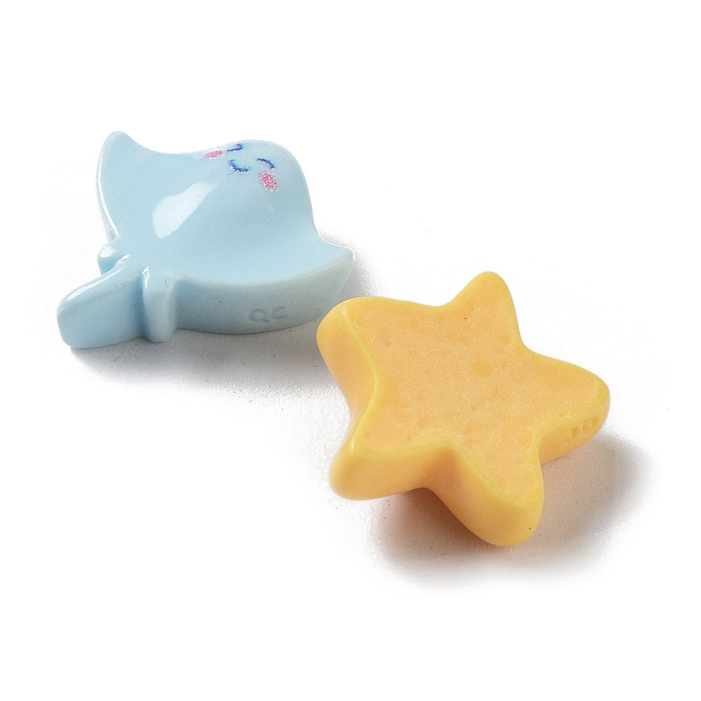 two small, colorful objects, one blue and one yellow, sitting on a white background.