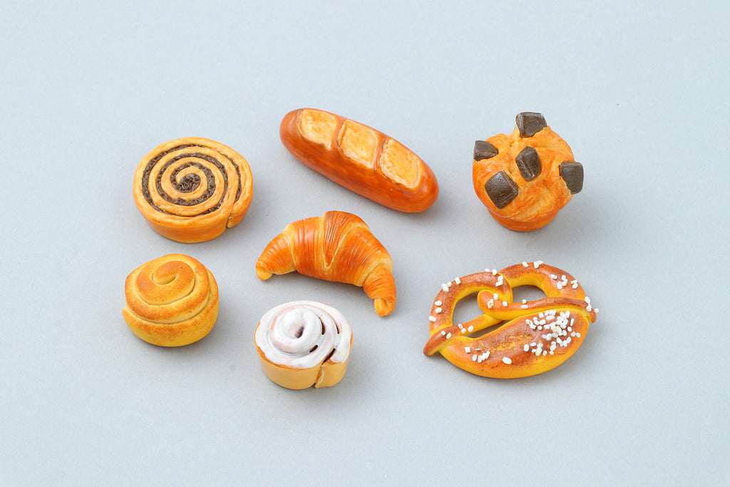 a group of different types of pastries on a table